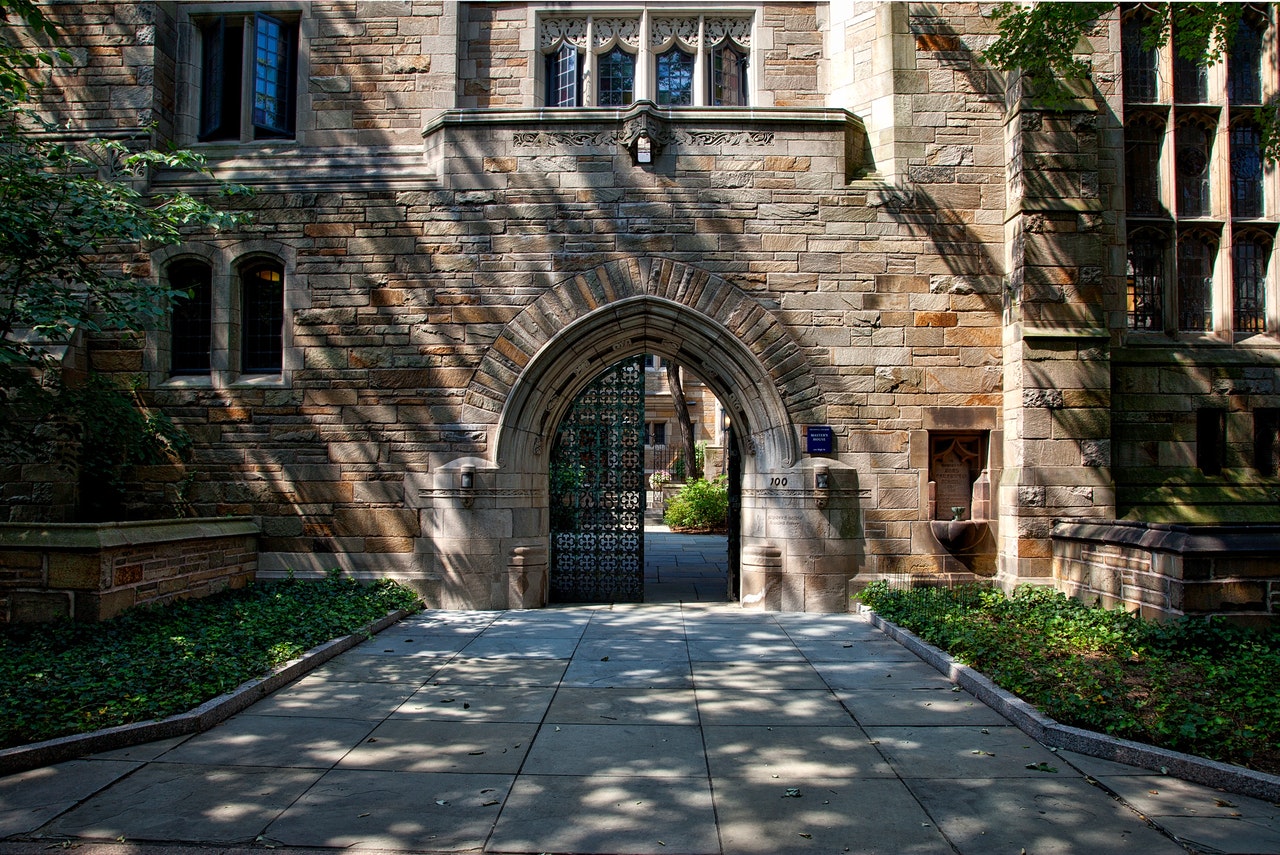 steel-gate-of-brown-brick-building-159490